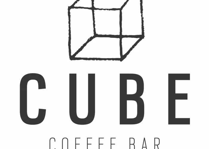 White background black image and text transparent cube and name of coffee bar